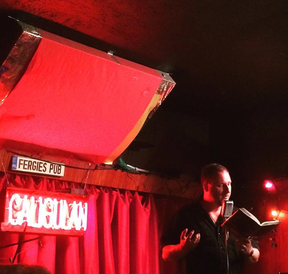 Hilbert reads from Caligulan at the Philadelphia launch at Fergie's Pub, where he performed with Quincy Lehr and the band the Keystone Swingbillies. Photo credit Niamh O'Connell. 